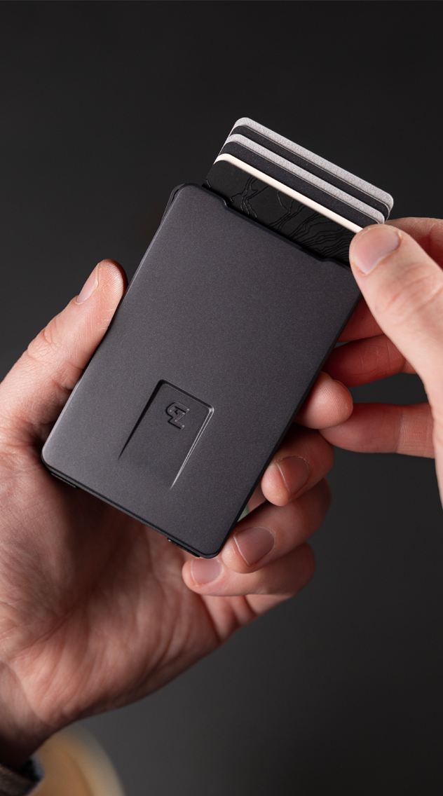 Guy holding Groove Life best selling Groove Wallet